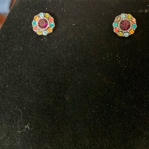 Purple stone surrounded by multicolored stones.  Pierced. 1/2” - Picture 1 of 1